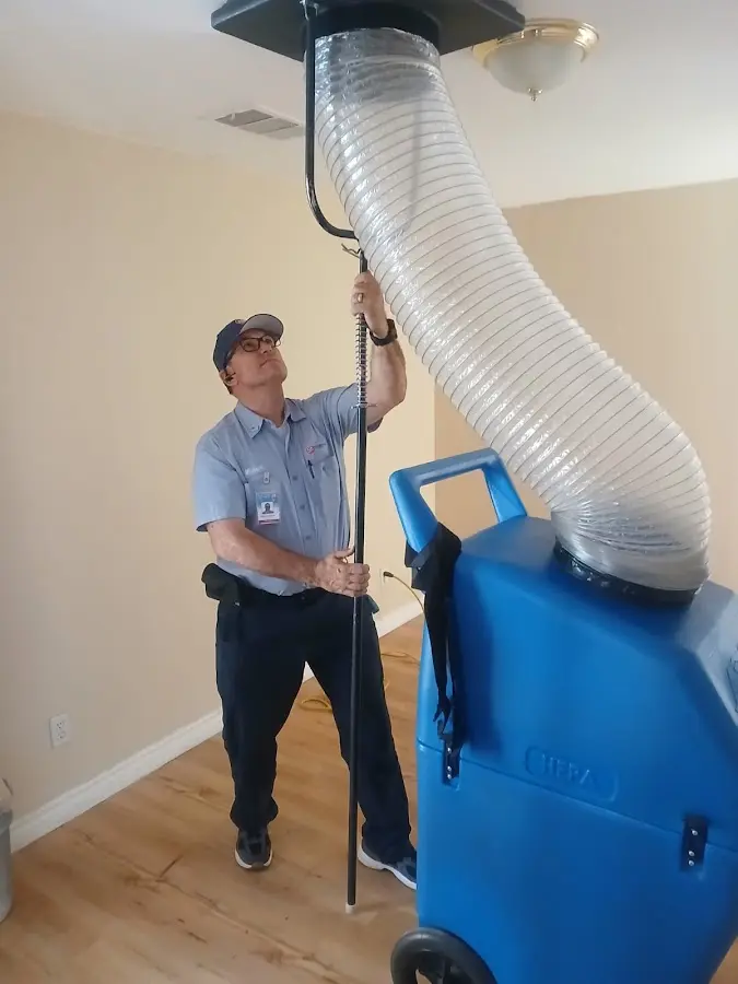 Furnace Tune-Up technician using HEPA equipment in Eloy